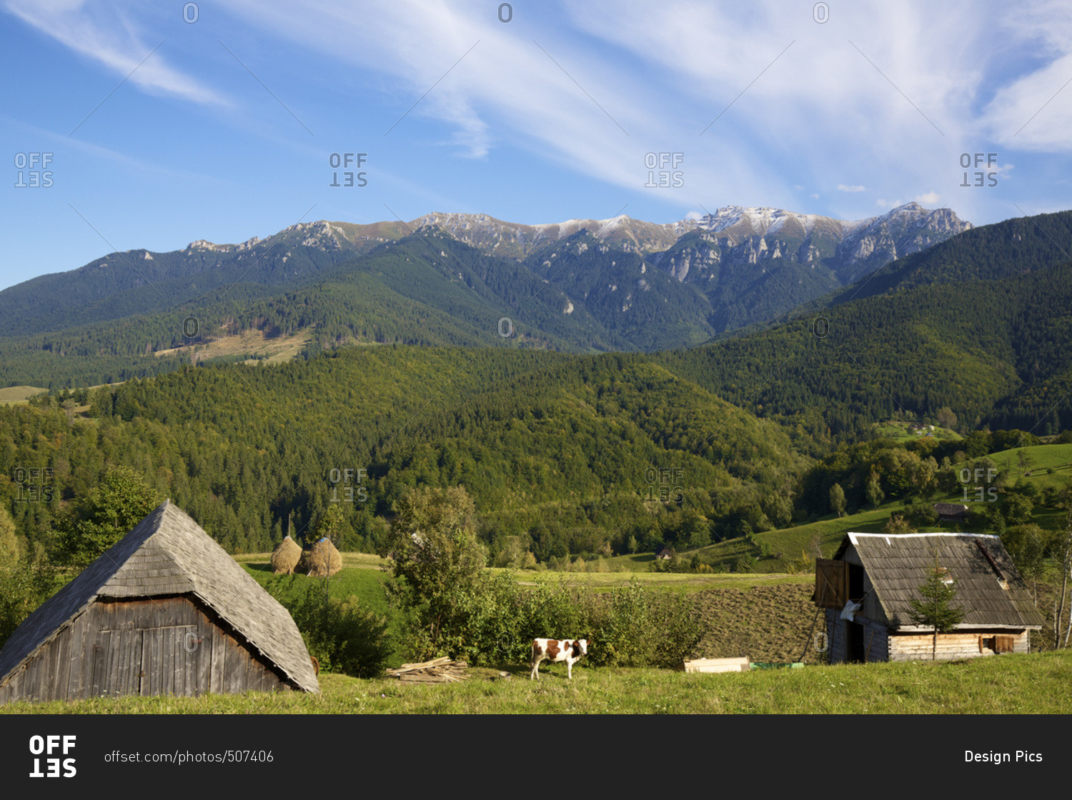 Rural landscape with farm buildings in Carpathian mountains