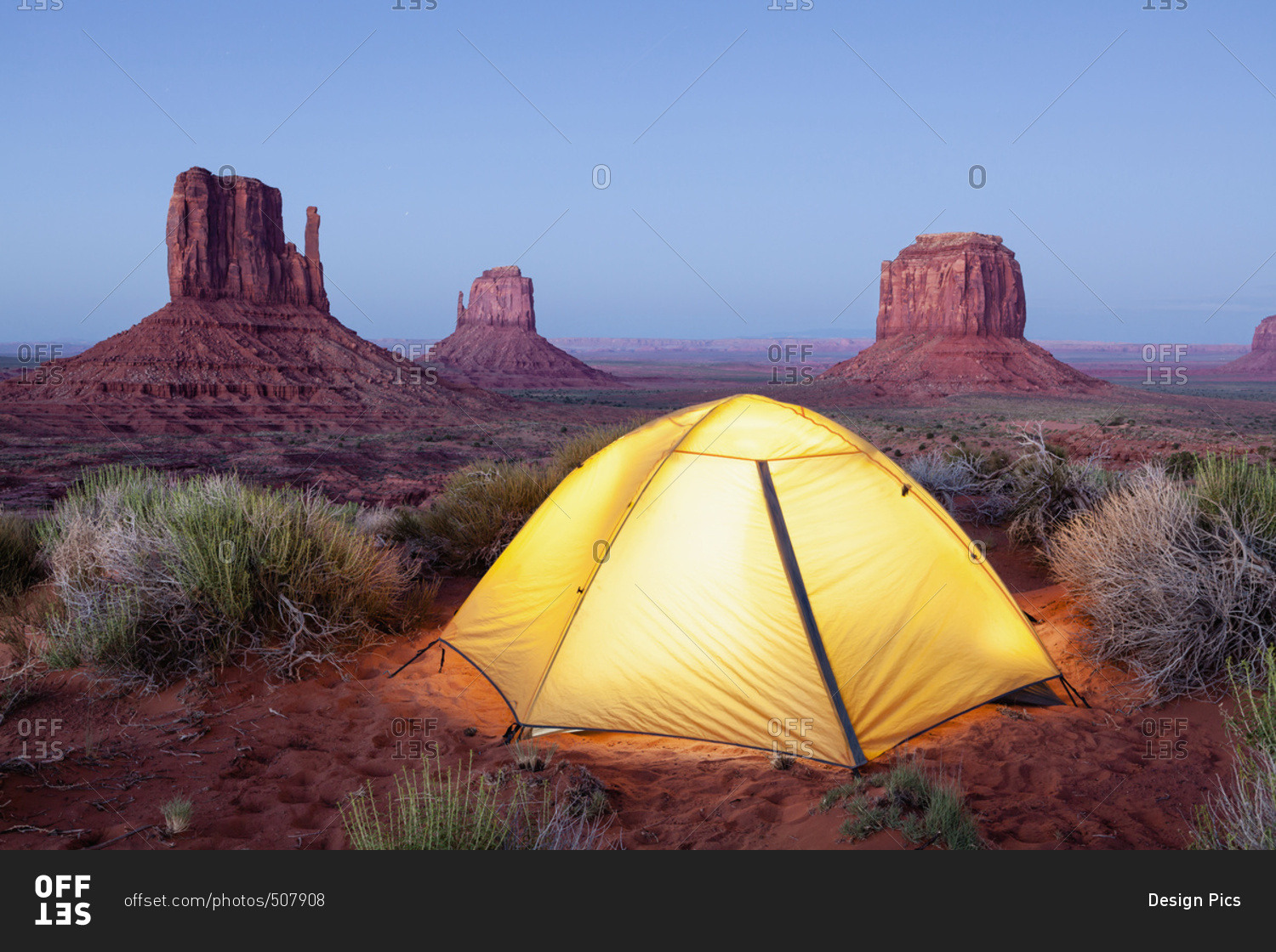 The Mittens and tent at dusk, Navajo Tribal Park, Monument Valley; Arizona, United States of America