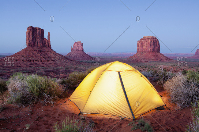 The Mittens and tent at dusk, Navajo Tribal Park, Monument Valley; Arizona, United States of America