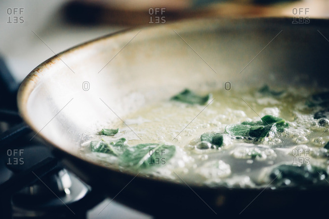 Butter in saute pan with fresh sage