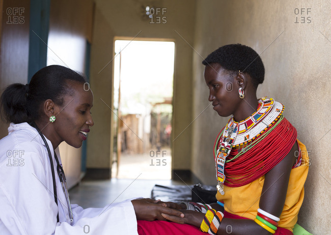 Doctor developing rapport with her Samburu patient at clinic in Africa