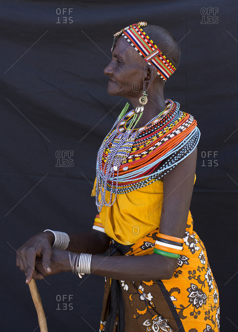 Elderly Samburu woman with beaded jewelry and cane