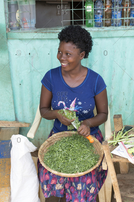 November 7, 2016 - Samburu, Kenya: Portrait of woman cutting green vegetables