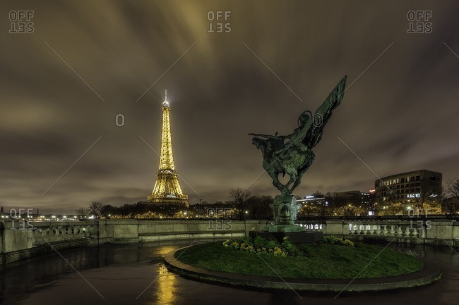 France,Francia, Ile-de-France, Paris.,  - March 29, 2015: Tour Eiffel and Jeanne D'arc statue .Paris, Ile-de-France , France