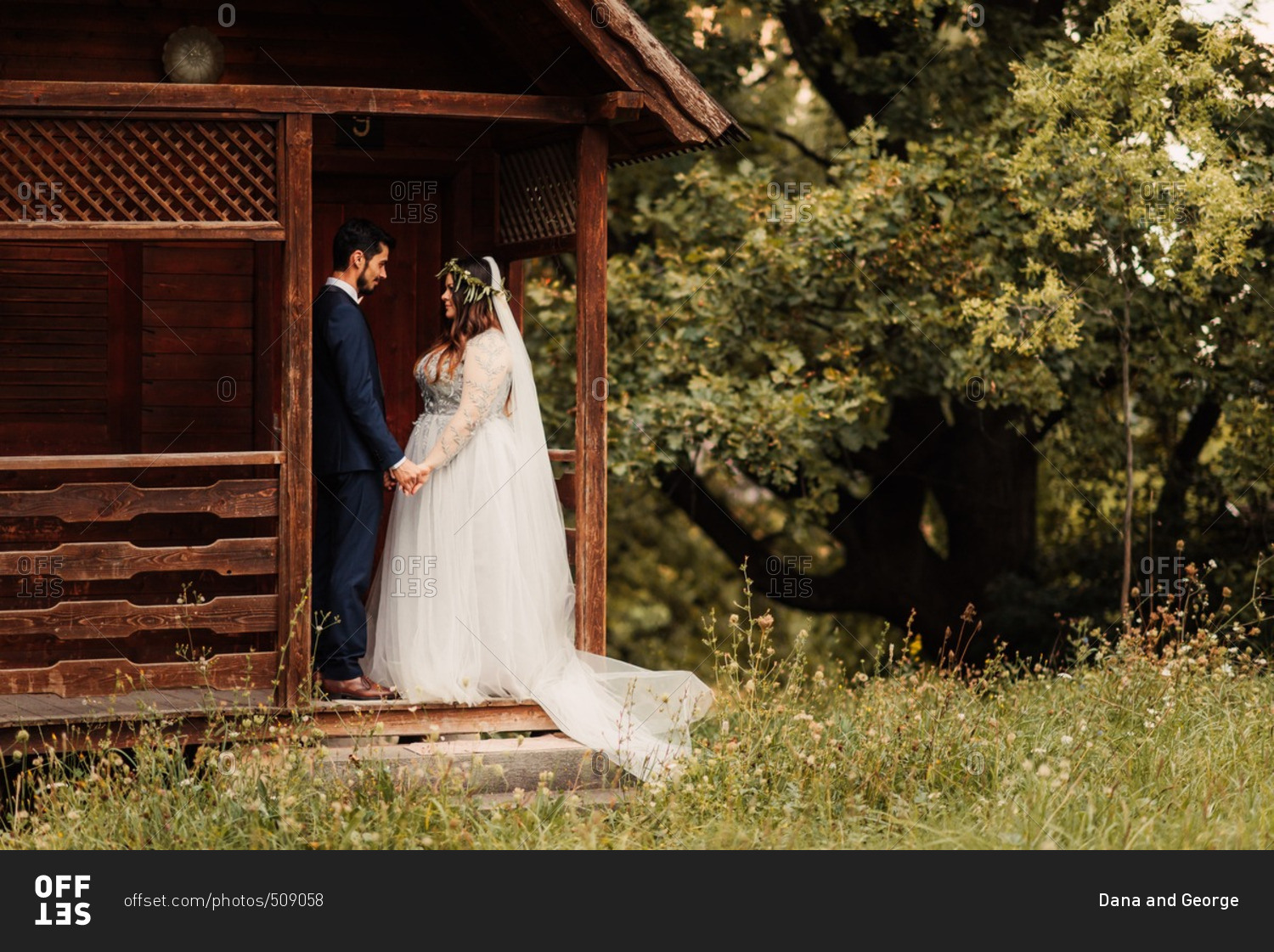 Bride and groom on a cabin porch