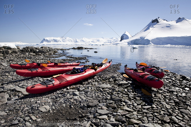 Kayaks pulled up on a beach in Paradise Bay, Antarctica