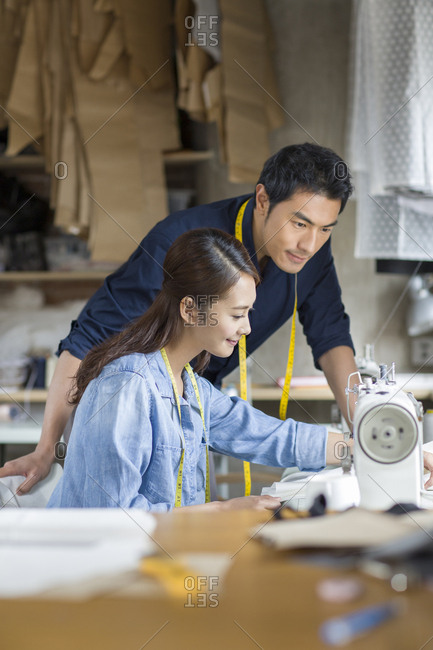 Two fashion designers working in studio