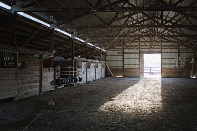Light streaming into barn from open doorway