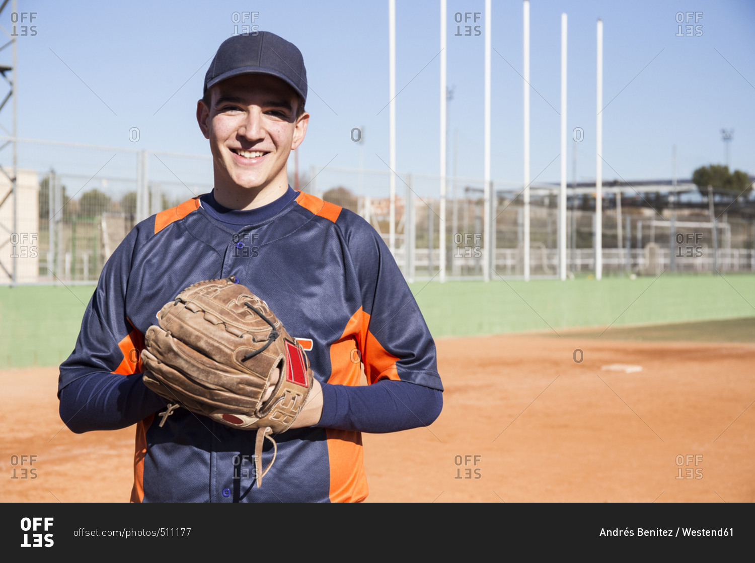 Portrait of smiling baseball player with a baseball glove