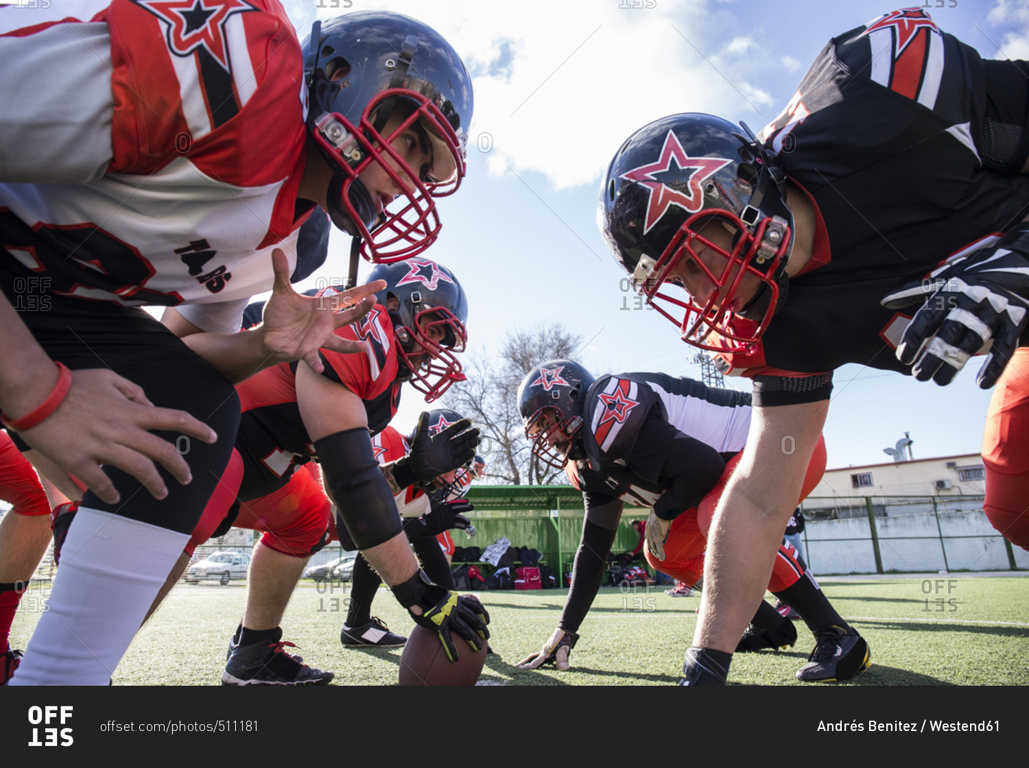 American football players on the line of scrimmage during a match stock photo OFFSET