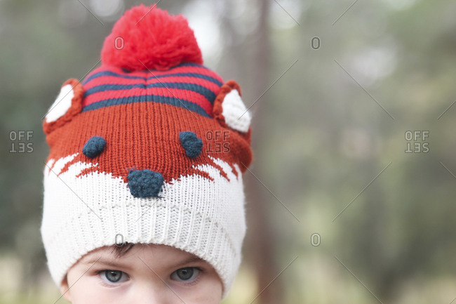 Close-up of boy wearing funny wooly hat