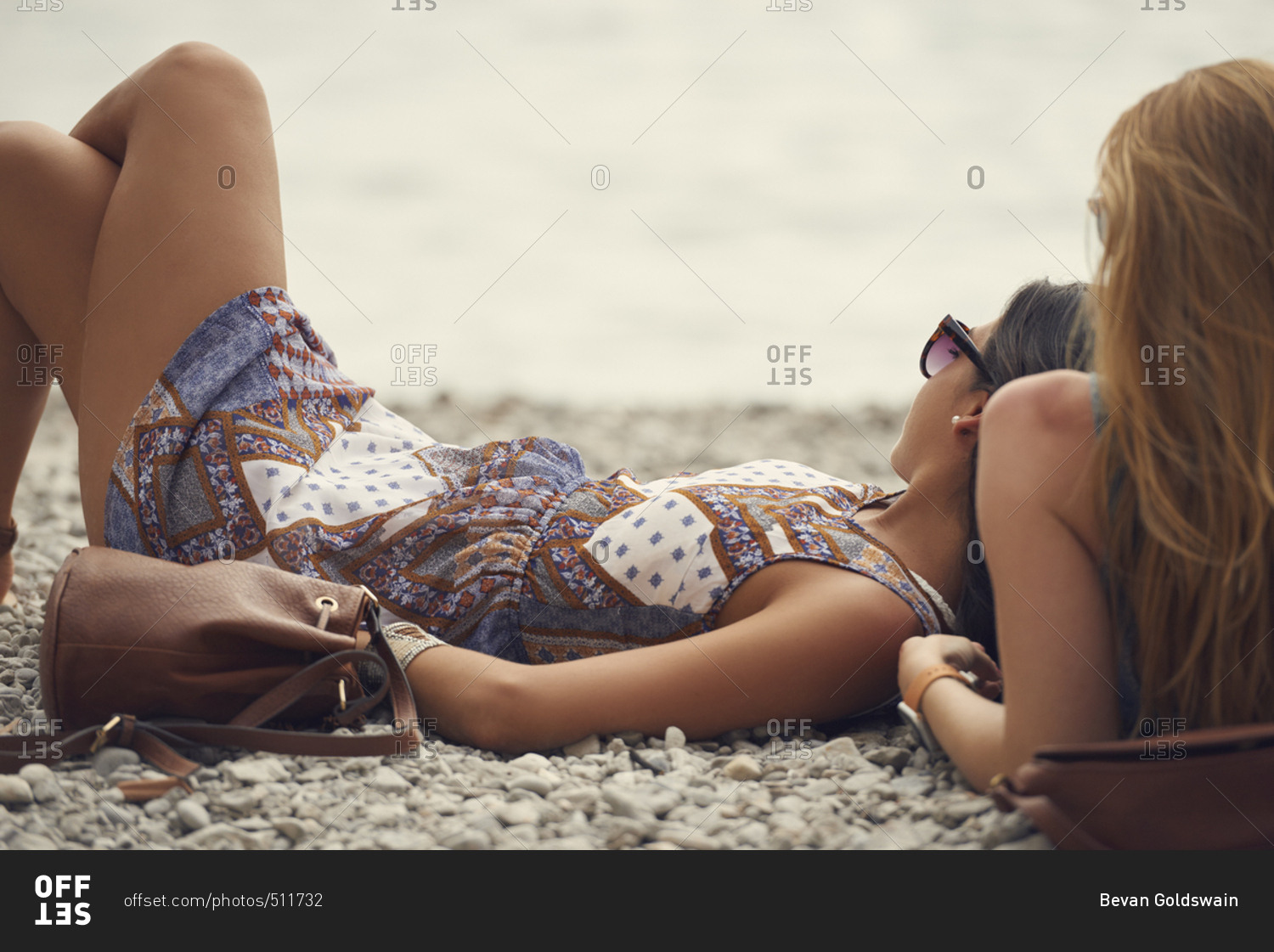 Beautiful girl friends relaxing on beach on travel adventure summer lifestyle