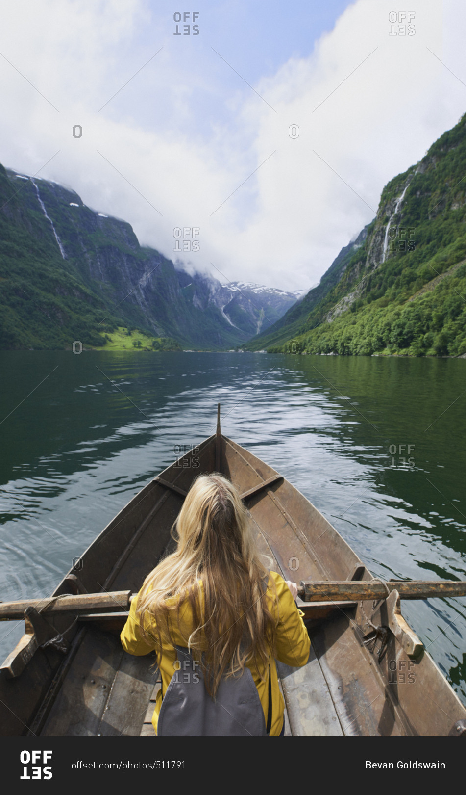 Adventure woman enjoying majestic river view from row boat epic landscape travel discover explore beautiful earth