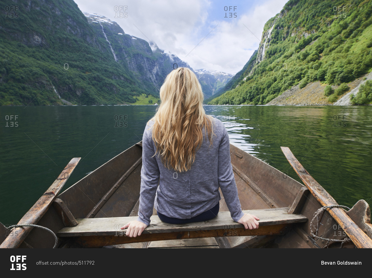 Adventure woman enjoying majestic river view from row boat epic landscape travel discover explore beautiful earth