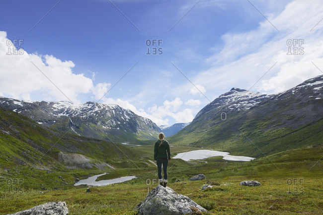 Travel adventure woman enjoying view of majestic glacial valley on exploration discover beautiful earth