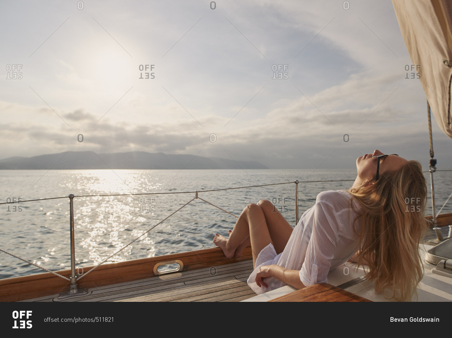 Beautiful girl friends on sailboat in ocean on luxury lifestyle happy adventure travel vacation