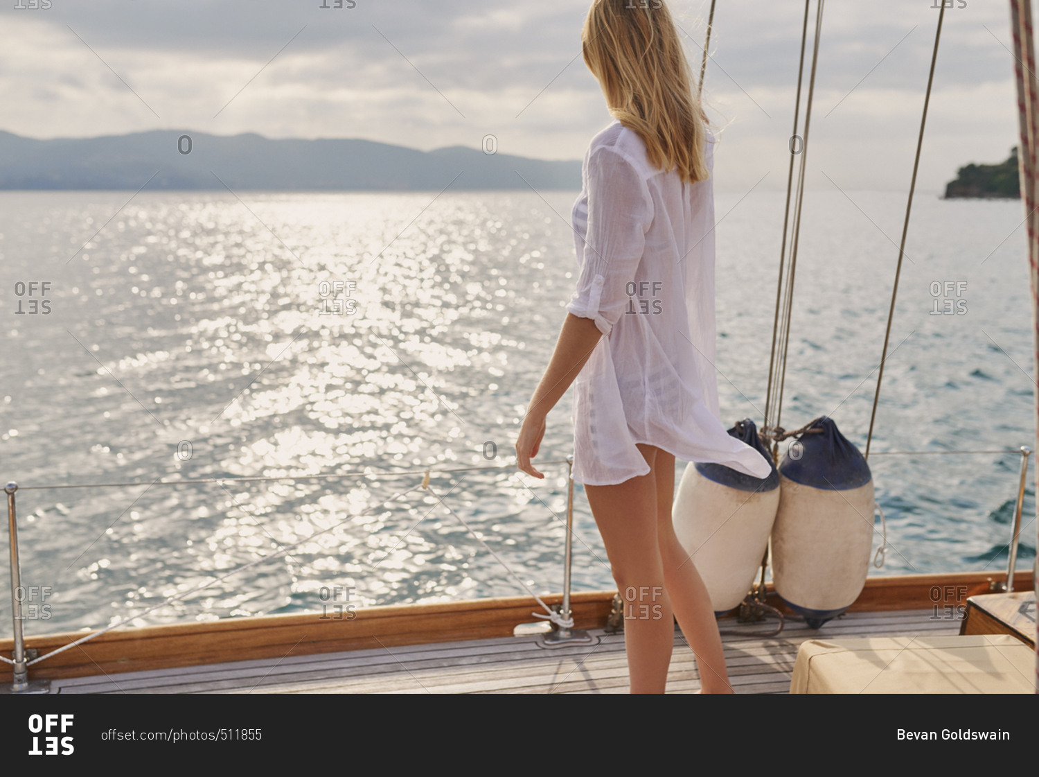 Beautiful girl friends on sailboat in ocean on luxury lifestyle happy adventure travel vacation