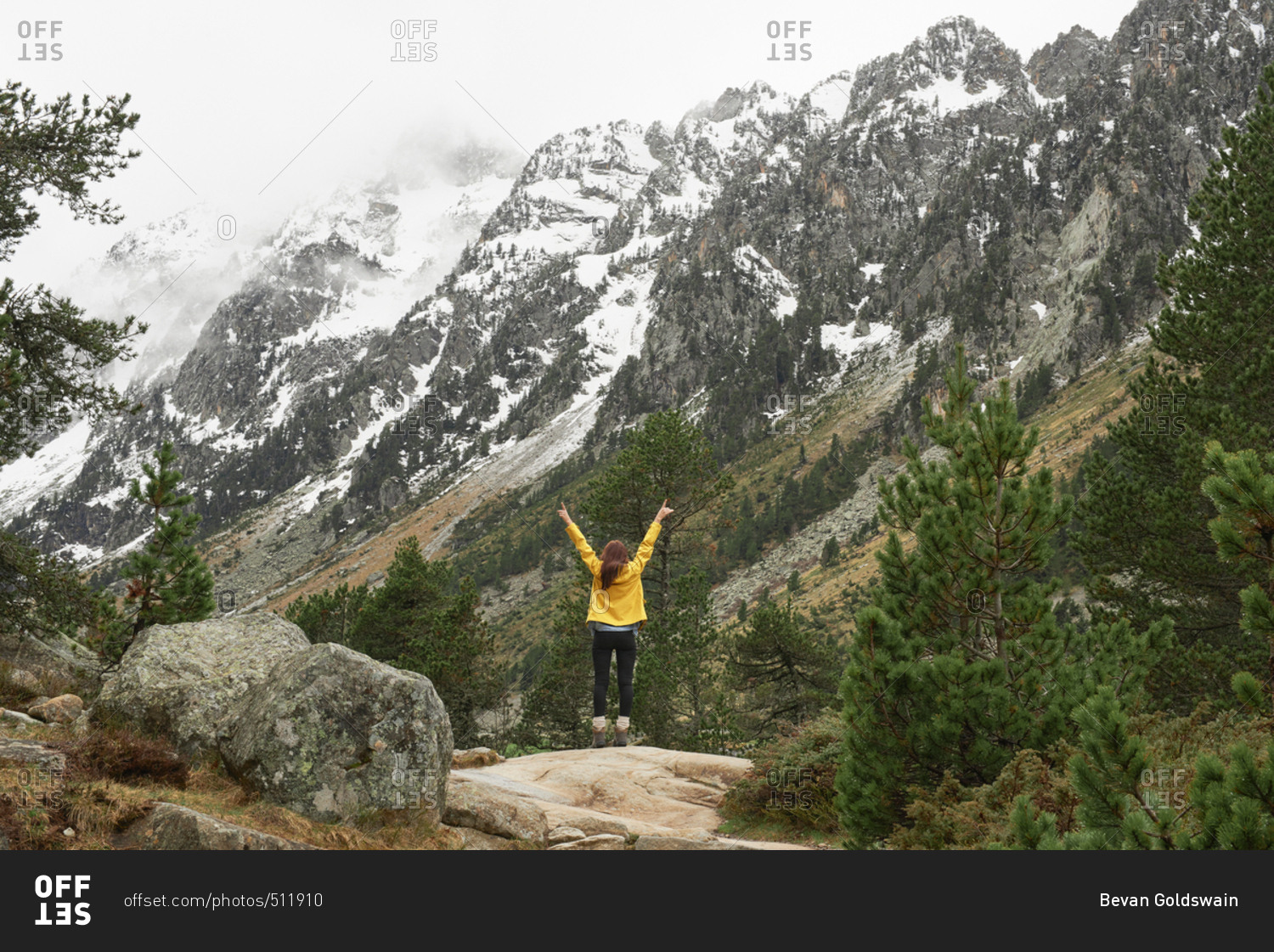 Travel adventure hiker woman celebrates arms outstretched enjoying beautiful nature forest landscape wanderlust