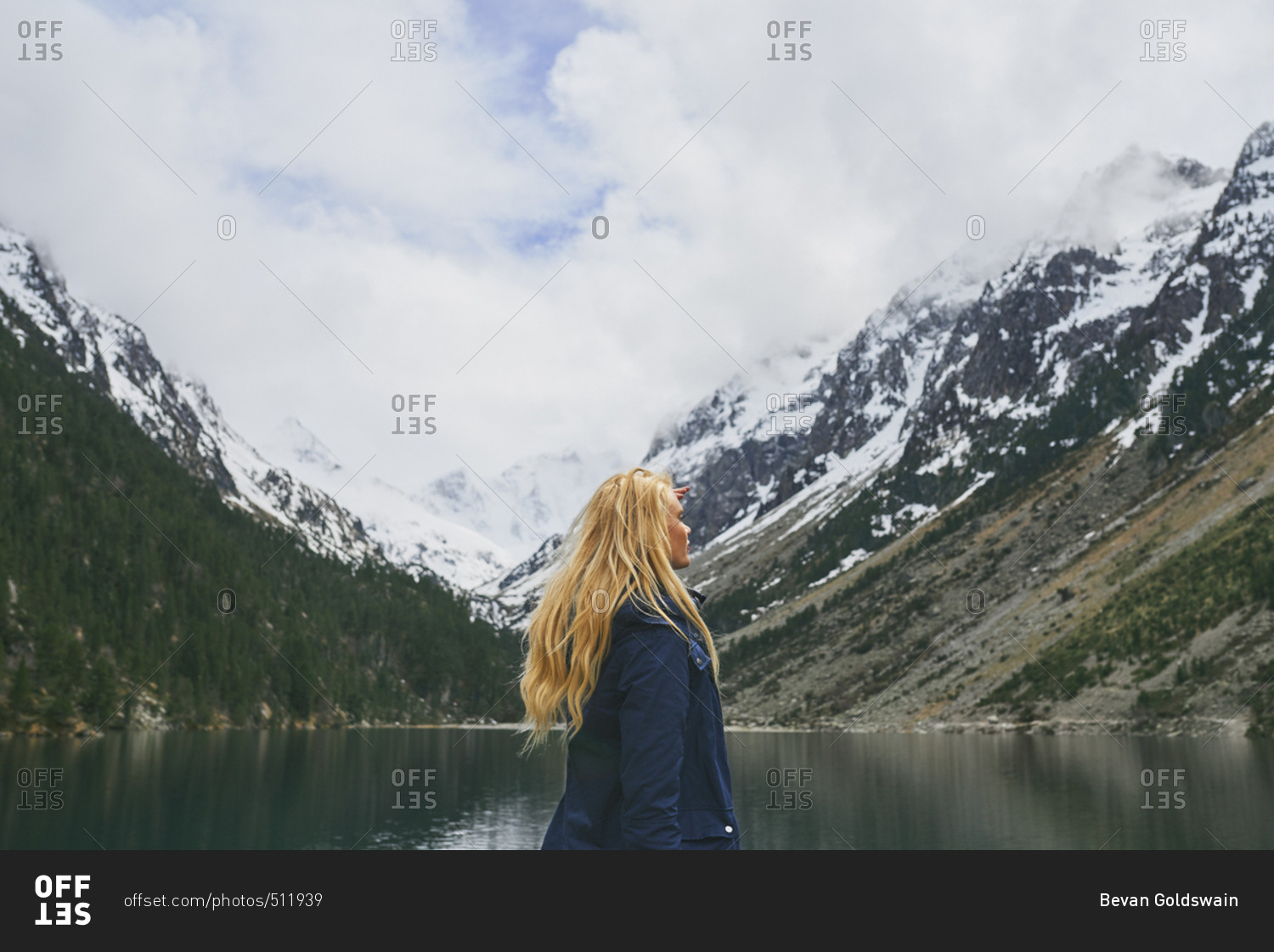 Travel adventure hiker woman on mountain lake enjoying beautiful nature landscape wanderlust
