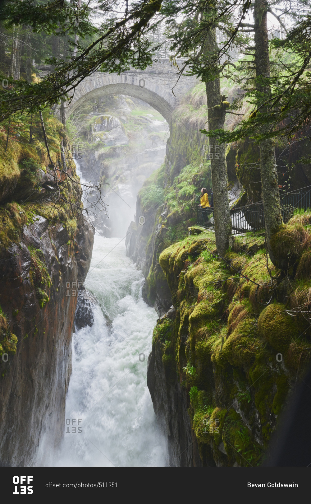 Adventure woman exploring Beautiful waterfall natural wonder on vacation