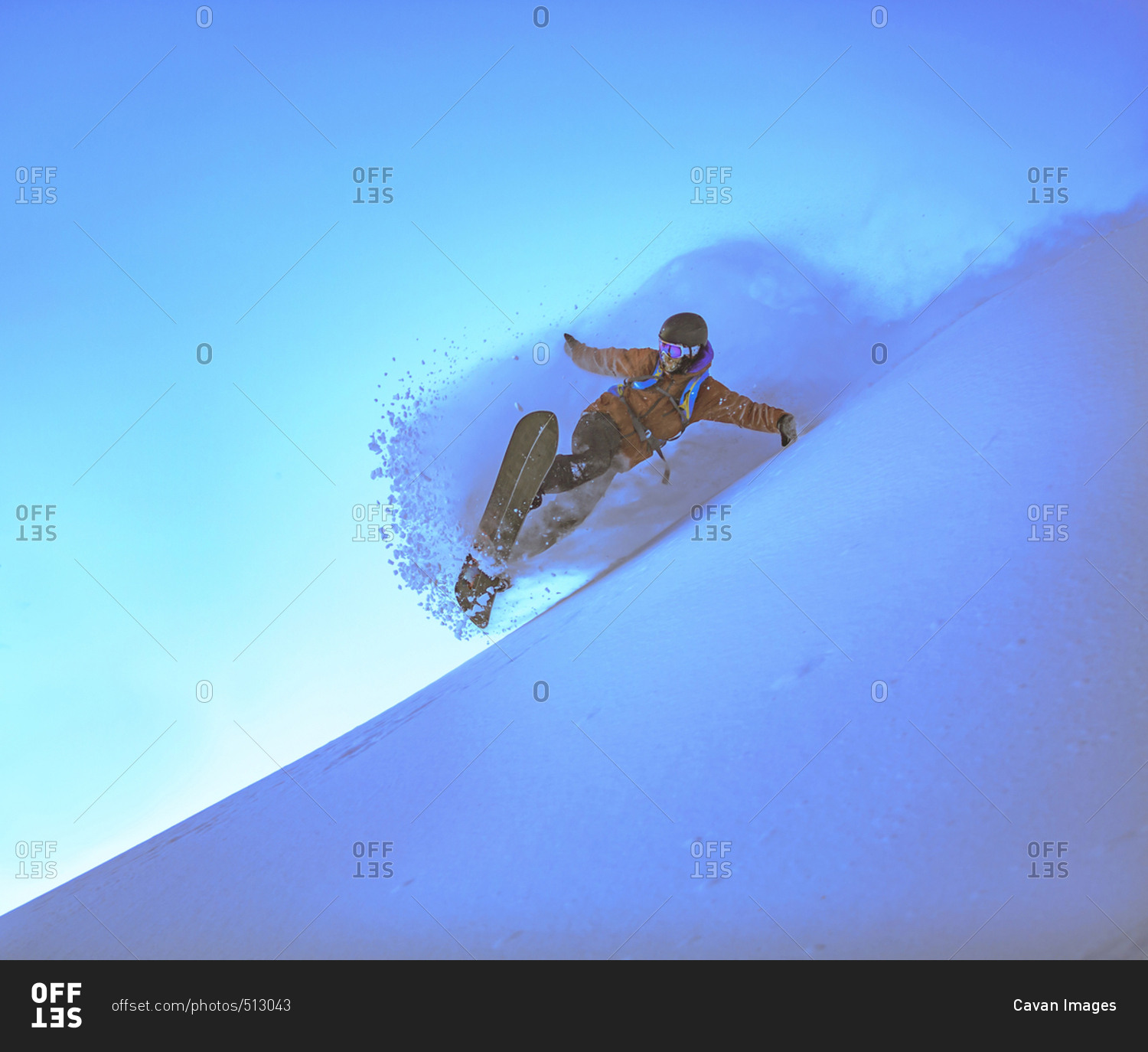 Man snowboarding against clear sky