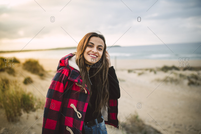 Portrait of relaxed young woman on the beach