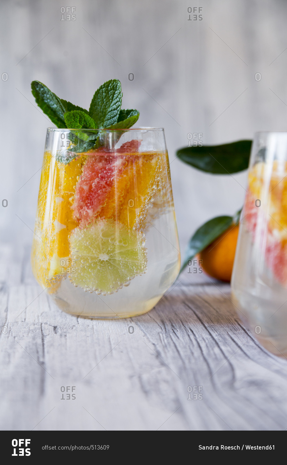 Two glasses of detox water infused with citrus fruits