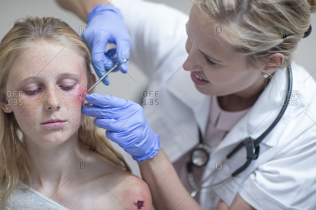 Injured girl getting treatment in hospital