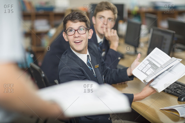 High school student with book discussing