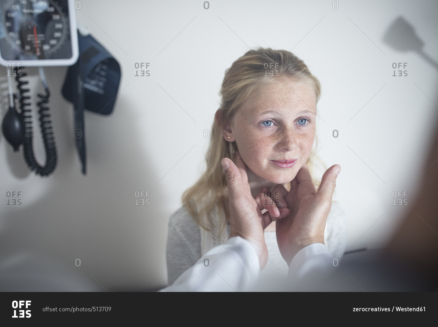 Doctor checking girl\'s lymph nodes