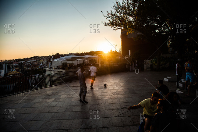 Lisbon, Portugal - July 12, 2014: Locals and tourists during the sunset in a public square in downtown