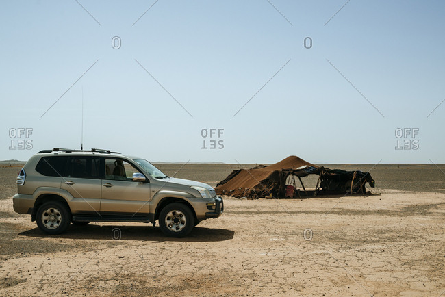 Tent and vehicle in remote desert