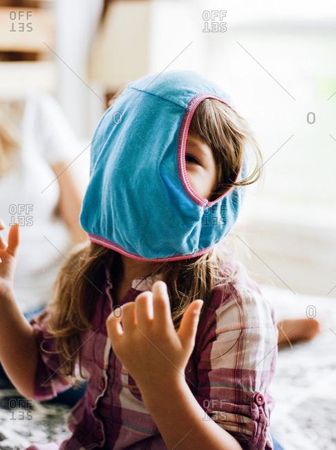 Young girl wearing a pair of underwear on her head stock photo