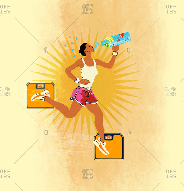 Woman drinking a fruit drink during exercise