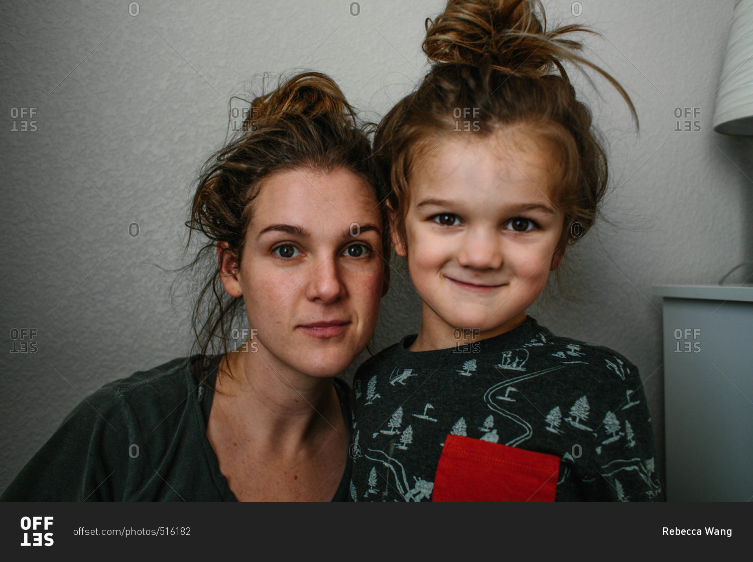 Mother and son with hair in messy buns