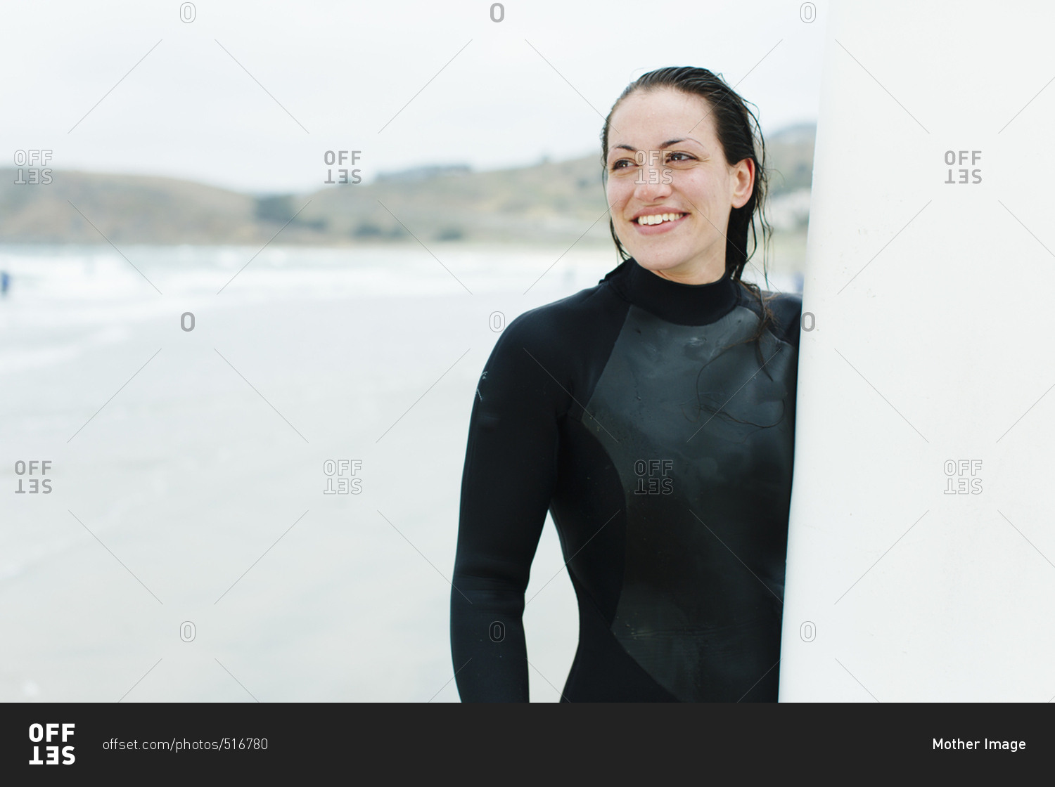 Female laughs at surf lesson in San Francisco, California