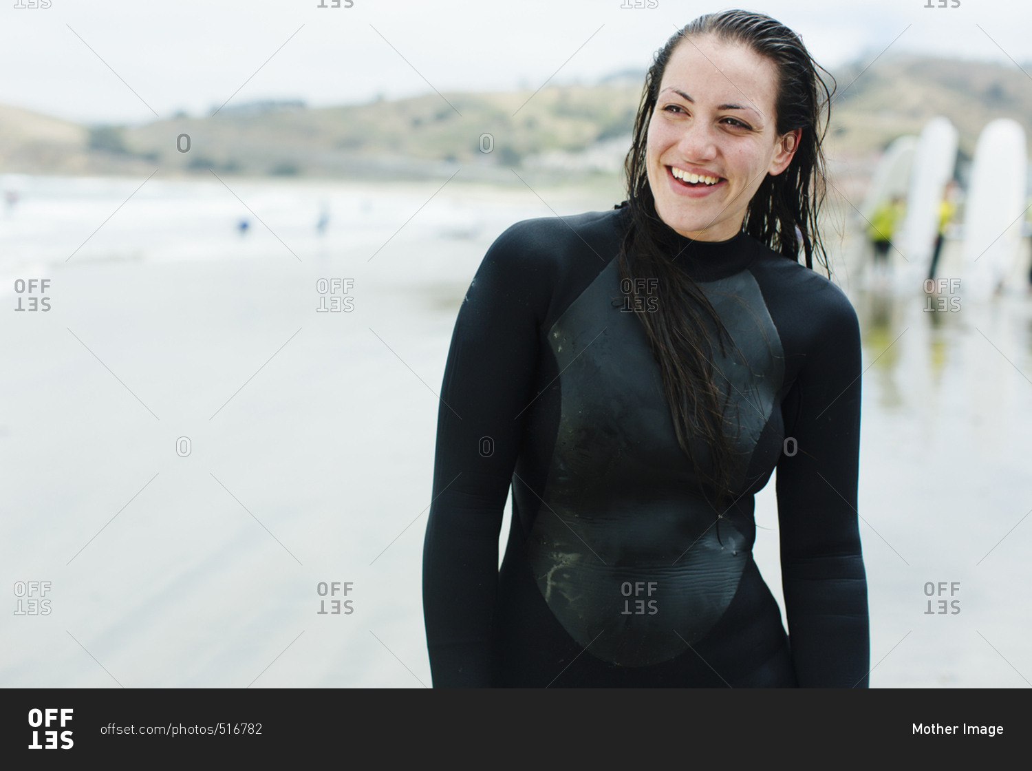 Female laughs at surf lesson in San Francisco, California