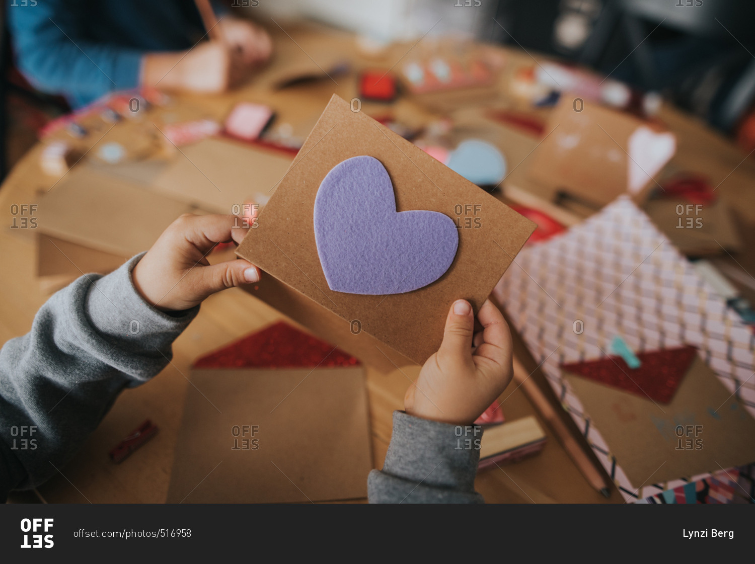 Boy holding a Valentine's day card with heart