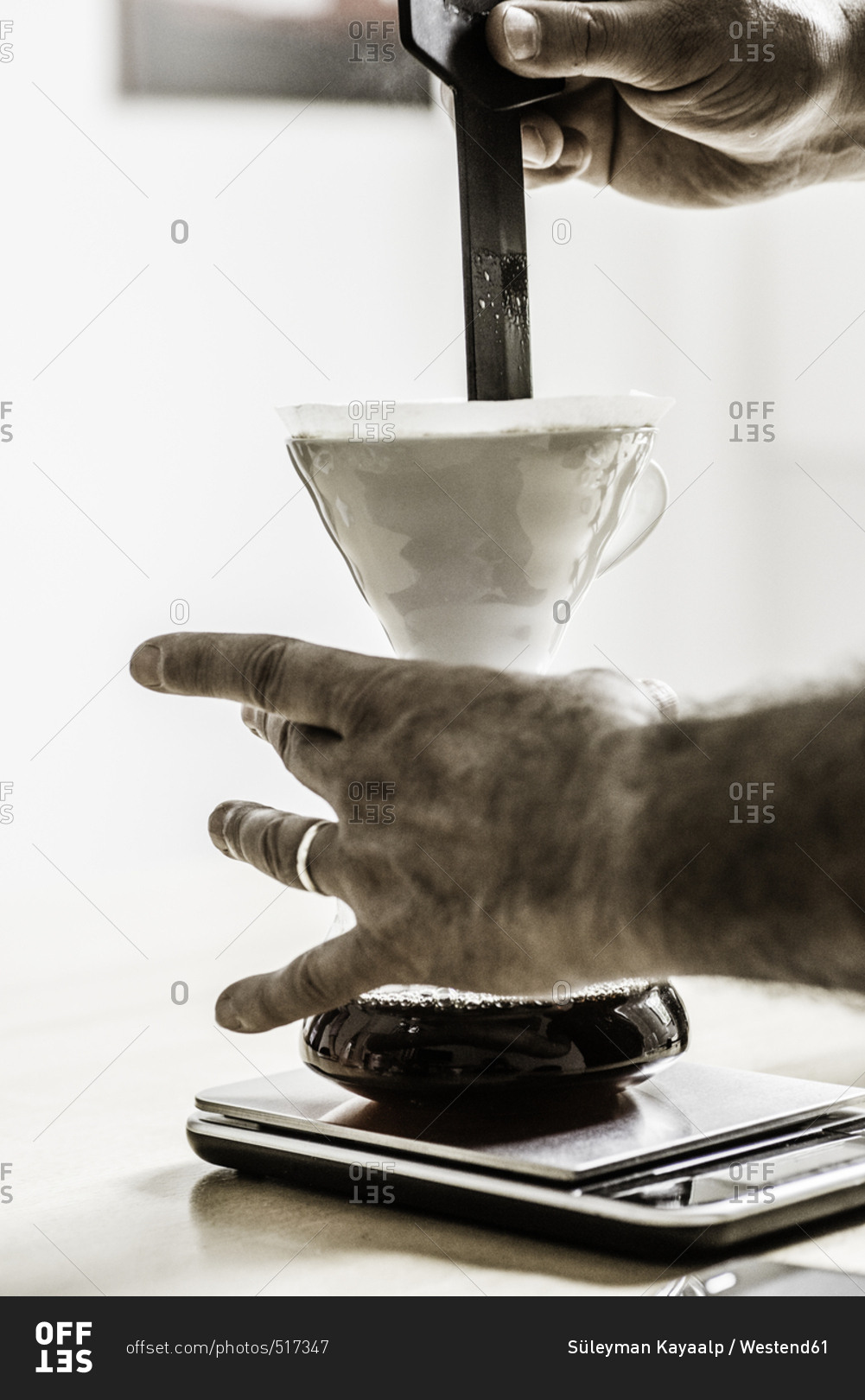 Man's hands preparing filter coffee