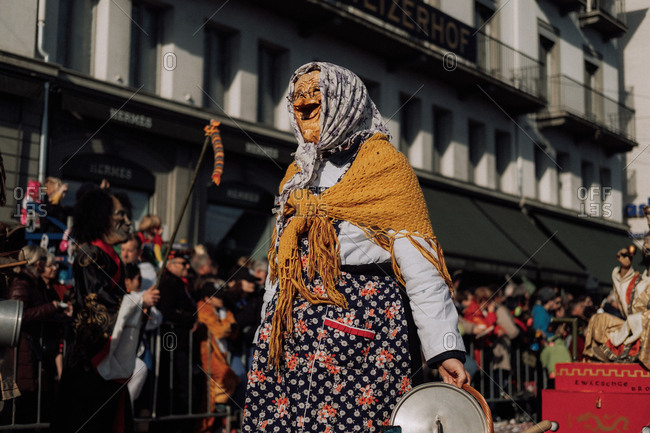 Lucerne, Switzerland - February 25, 2017: Person dressed as a strange old woman at the Lucerne Carnival Parade