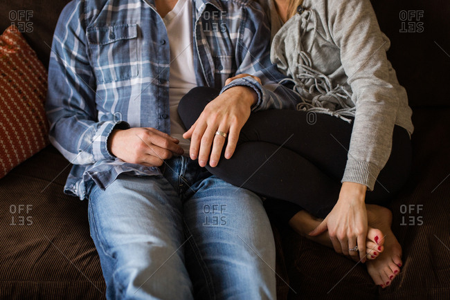 Couple Snuggling On Couch Together Stock Photo Offset