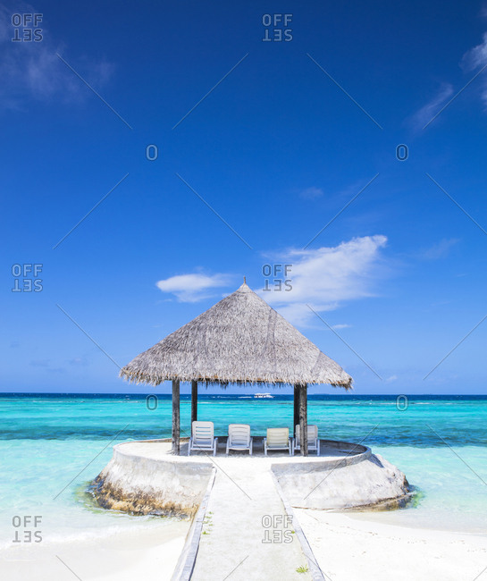 Maldives-South Male Atoll- Sun loungers under parasol