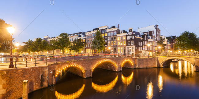 Netherlands- Amsterdam- lighted bridges over Emperor's Canal and Leidse Canal in the evening