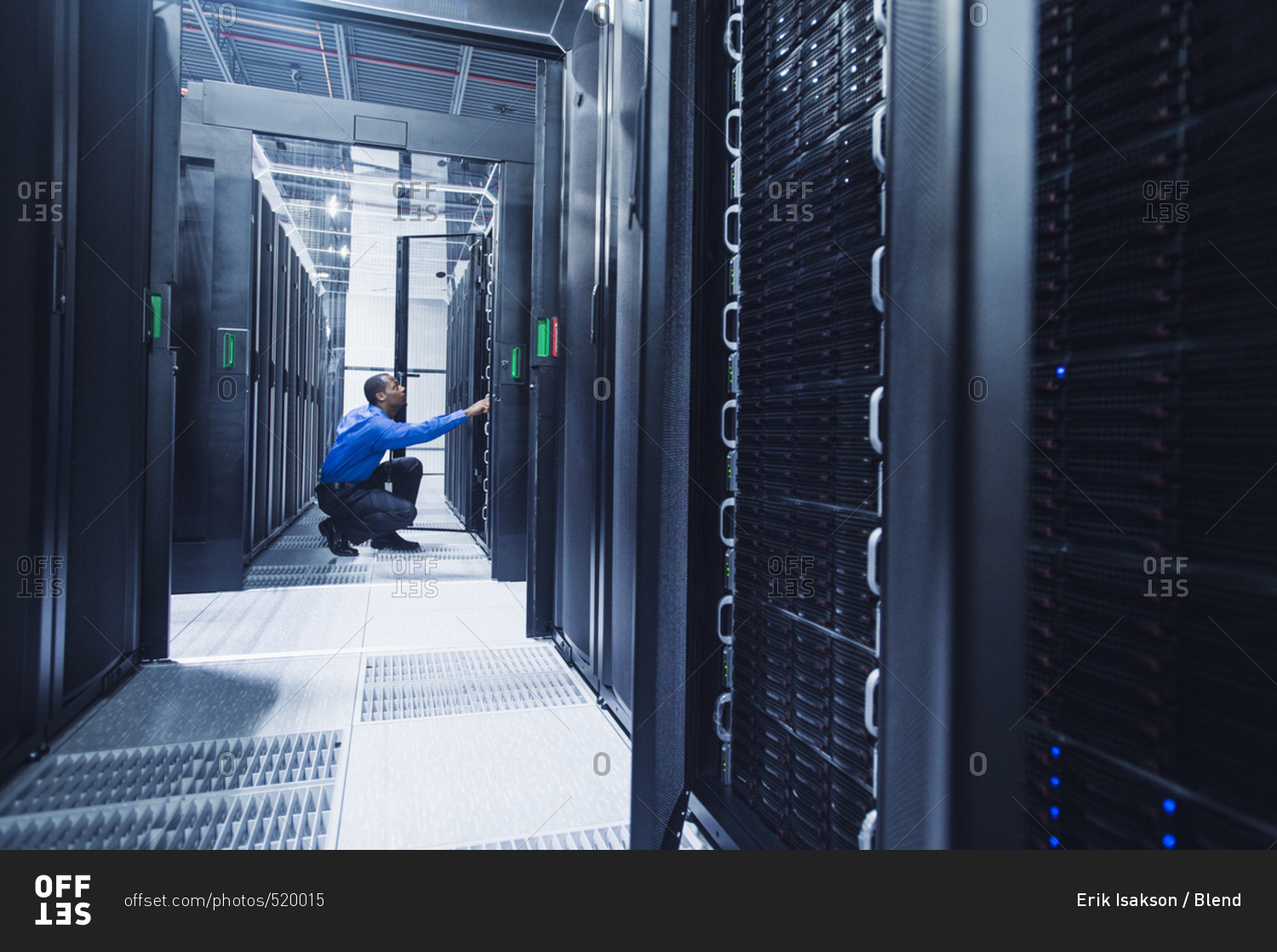 Black businessman working in server room stock photo OFFSET