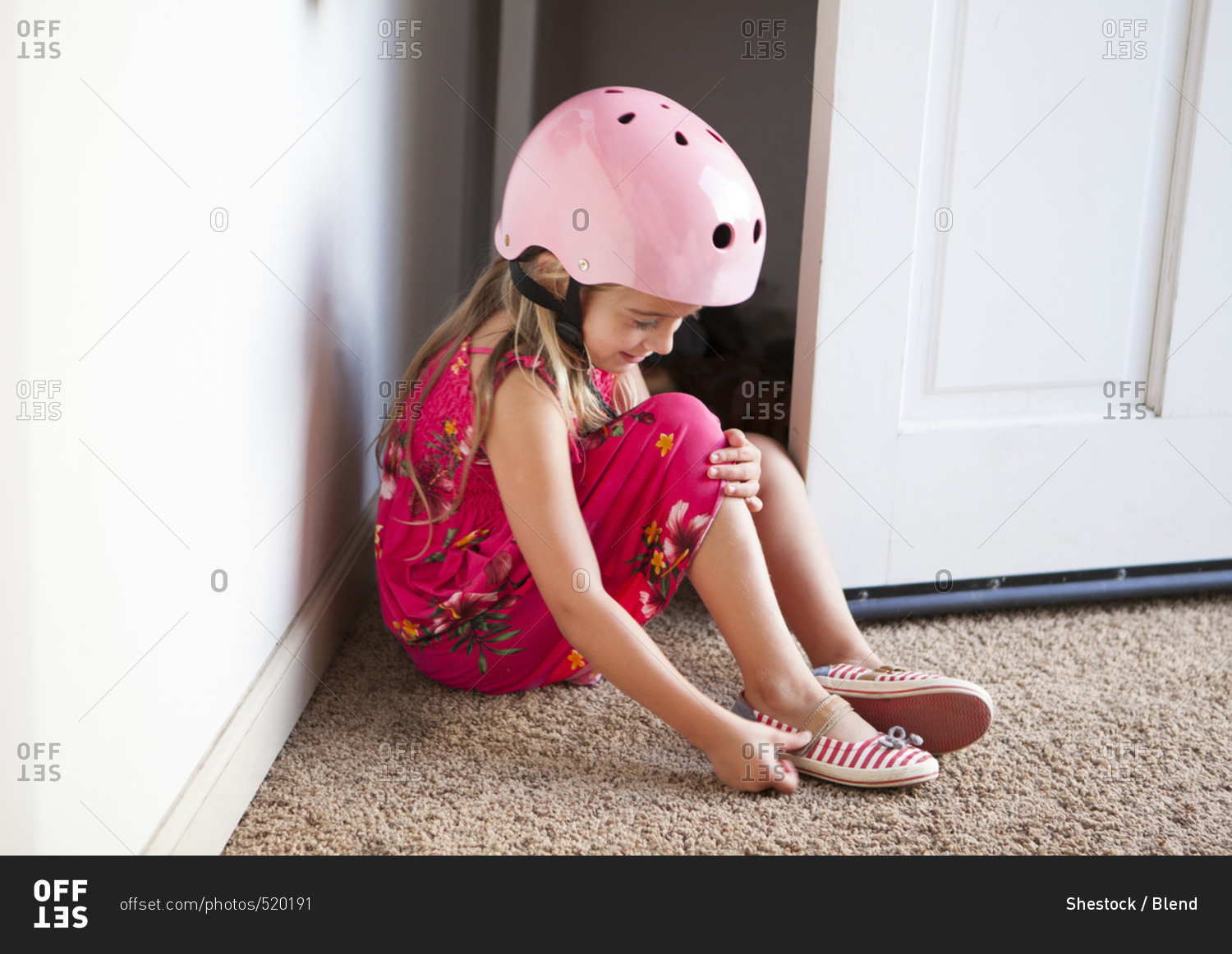 Caucasian girl wearing bike helmet in doorway