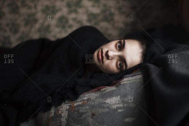 Caucasian woman laying on sofa