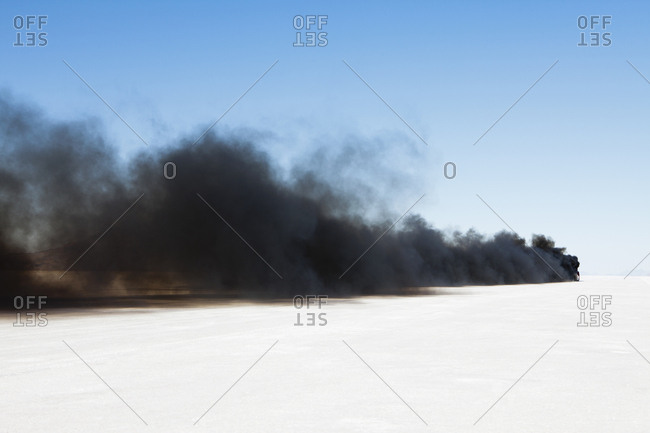 Black diesel smoke from racing truck on the Bonneville Salt Flats, UT