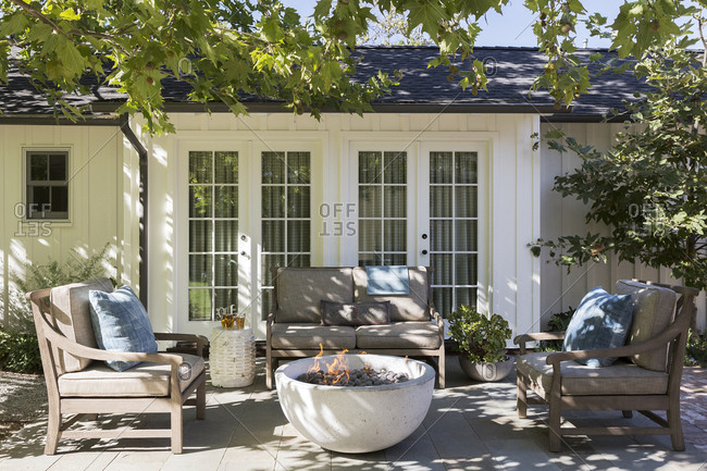 Patio With Stone Fire Pit In The Backyard Of A Los Angeles Home