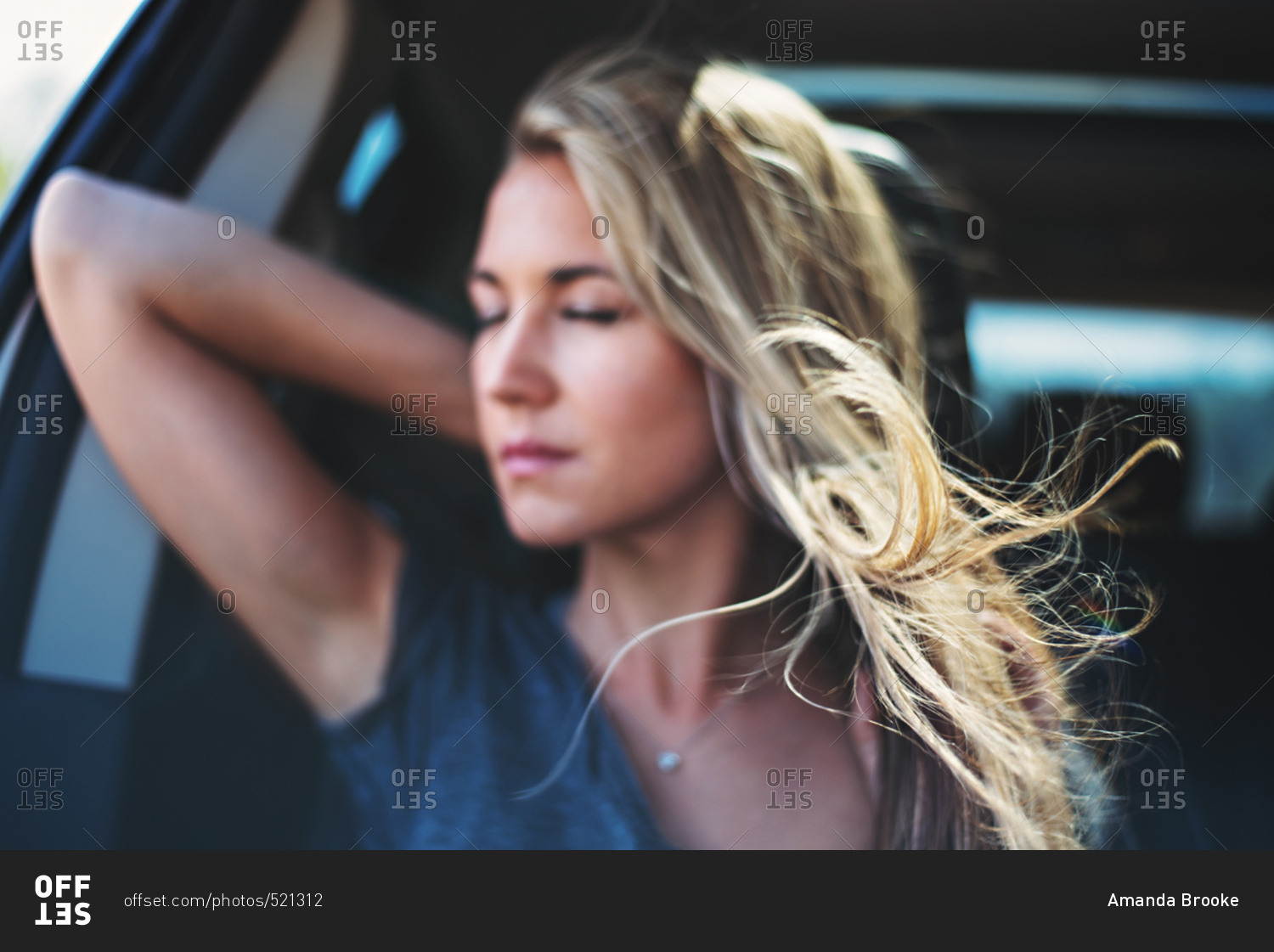 Woman With Hair Blowing In Car Stock Photo OFFSET