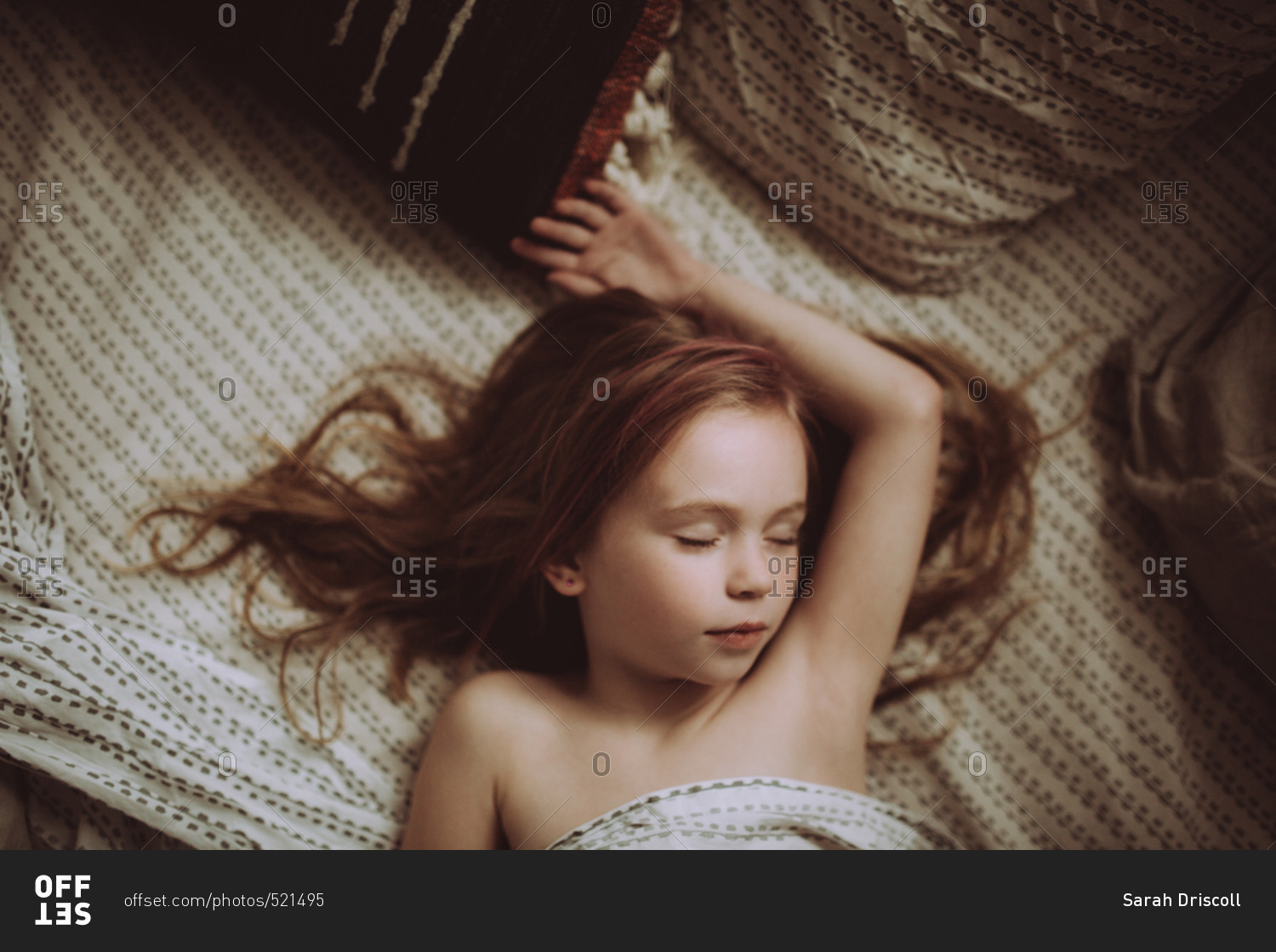 Girl sprawled asleep on her bed stock photo OFFSET